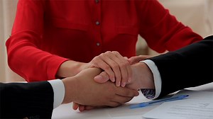 Triple Handshake of Businessmen