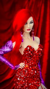 Inspired by the iconic Jessica Rabbit, this look blends cartoon seduction with couture detail: a sculpted red gemstone gown that feels molten and alive, paired with violet opera gloves and oversized amethyst earrings for a touch of playful glamour. It’s dramatic, camp, and unapologetically femme. #jessicarabbit #crimson #ruby #doll #glam | Kha Hoang