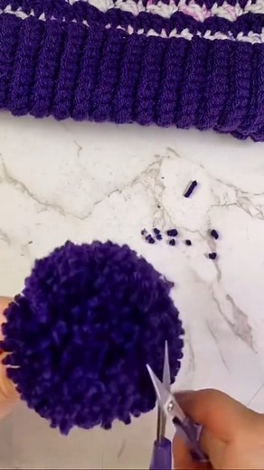 Have you tried making yarn pom poms? They're easy with a pom pom maker! Learn more: https://www.nickishomemadecrafts.com/tutorial-how-to-make-a-pom-pom-with-a-pom-pom-maker/ #crochet #crocheting #learntocrochet #yarn #yarnpompom #pompom | Crochet Patterns & Tutorials by Nicki's Homemade Crafts