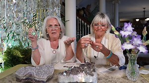 Please join Jenniefer & Helen for our Venus Seaview Moon Halo Show! SHOP NOW: kirksfolly.com Behold the enchanting necklace enhancer, a celestial treasure that adorns the neck with ethereal elegance. At its heart lies a serene and peaceful seaview moon stone aglow with mesmerizing radiance. Encircled by a boarder of glimmering crystals, the moon emanates a celestial allure, gently swaying from a halo encrusted with more twinkling crystals. Wear the enhancer on your favorite necklace. | Kirks Fol