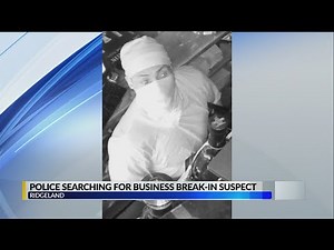 Police searching for business robbery suspect