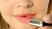Young woman, red lips with lipstick. Recorded by the camera RED...