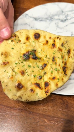 Soft homemade naan bread recipe with fluffy texture