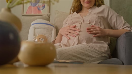 Pregnant Woman Contemplates Baby Sonogram - Free Stock Video