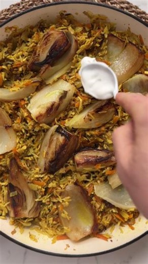 GOLDEN FENNEL RICE 🌟 If you can’t tell, we’re mad for a one-pan rice dish at the moment. Cue our Golden fennel rice with lemon yoghurt - It is quite literally sunshine in a pan. Packed with veg and with a creaminess from the coconut milk, its topped off with lemon infused yogurt and a handful of flaked almonds. For the full recipe 👉 https://www.bosh.tv/recipes/golden-fennel-rice | Bosh