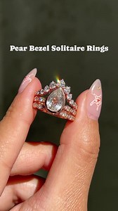 Level up your love story with our stunning pear-fect bezel engagement...