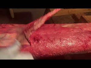 Fleshing otter with fillet knife