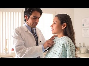 Hispanic Doctor Listening To Woman's Heartbeat. Stock Footage
