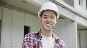 Download Young Asian construction site engineer,close up. for free