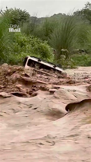 Dramatic moment Jeep swept away by floodwater in Northern India