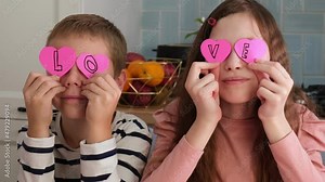 Valentines Day. Kids Crafts Paper Heart, tracing and cutting out hearts from pink paper for valentines day. Children crafts during homeschool preschool and kindergarten art class. Painting, DIY.