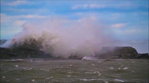 This memory popped up on my timeline: Epic windstorm on Lake Ontario thrashing the West Pier Head and Lighthouse in Oswego, NY. | Montanus Photography