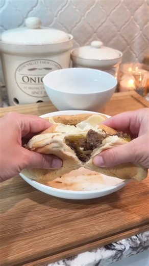 Dripping Beef Hoagies is a tantalizing sandwich recipe featuring tender beef, savory seasonings, and tangy pepperoncini peppers. The beef is seasoned, browned, and simmered with onions, garlic, herbs, and beef broth until it's fall-apart tender. Finally, the shredded beef is piled onto hoagie rolls, topped with provolone cheese, and served hot, creating a flavor-packed, satisfying meal. Find the recipe here! https://www.baileeskitchen.com/dripping-beef-hoagies/ #beef #dinner #dinnertime #dinneri