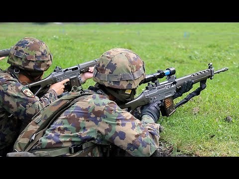 Swiss Soldiers in Action During A Live Fire Range