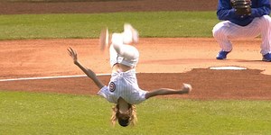 Olympic gymnast Nastia Liukin showed off her skills with a flipping windup on her first pitch