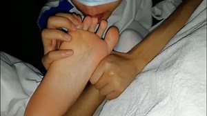 Licking boy feet