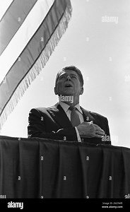 GOP presidential candidate Ronald Reagan salutes the flag during singing of the Star Spangled Banner at a campaign stop in Sunnyvale, Thursday, Sept. 25, 1980. Reagan made a brief campaign appearance at the Western Electric Company before flying on to Portland. (AP Photo/Harrity Stock Photo - Alamy