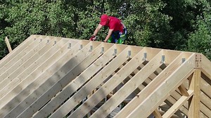 Construction Worker Building Roof Truss
