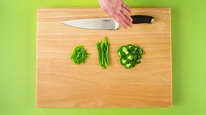 Jalapenos are hot green peppers that are often used in Mexican cuisine. Use your Calphalon cutlery to slice jalapenos three ways – rounds, ribbons, and diced. Learn more at www.knifeskills.com. | Calphalon