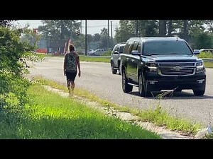 Woman squats and piss in middle of road