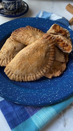 These beautiful freshly baked empanadas de camote are filled with sweet potato, slowly simmered in cinnamon and anise. https://dorastable.com/empanadas-de-camote/ #veganmexicanfood #veganempanadas | Dora's Table Vegan Mexican Recipes