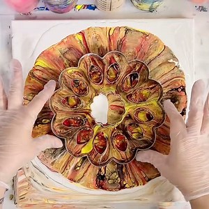 This is a fun fall-colored acrylic pour through a pie crust cutter I got from Michaels. Happy Thanksgiving! | Mixed Media Girl