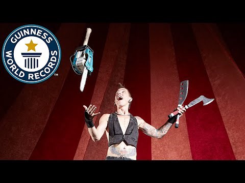 Under leg chainsaw juggling - Guinness World Records