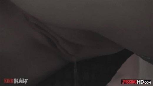 Crazy chick in a gas mask swallows a ton of pee