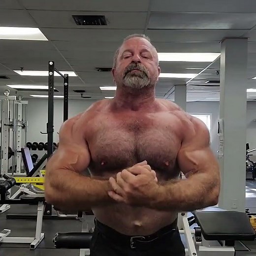 Muscle bear muscle daddy flexing shirtless at the gym