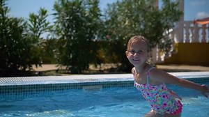 Little Girl Splashing Swimming Poolslow Motion Stock Footage Video (100% Royalty-free) 1045474255 | Shutterstock