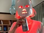 January Jones dances while drinking beer and wearing LED mask