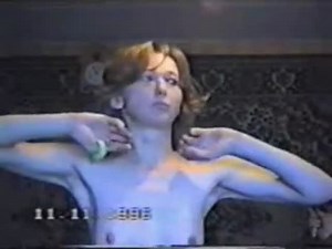 Mature BDSM slave is whipped naked by her master