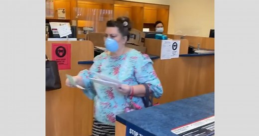 Woman who appears to hurl racial slur at California postal worker is denounced by bystanders