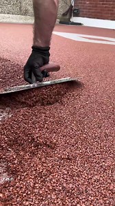 Satisfying resin driveway installation from mix to smooth finish