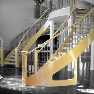 [Hot Item] Wrought Iron Railing Design Double Steel Beam Lobby Curved Staircase with Oak Wooden Stairs Step