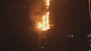 Flames engulf world's tallest residential tower in Dubai. More than 40 stories of the 86-story torch tower were burning on one side. | Preston Phillips