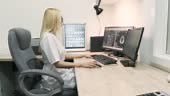 Professional female doctor radiologist examines brain CT or MRI scan...