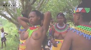 Topless South African girls get traditional make up