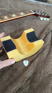 Here is a neck rest I made. It provides a safe and secure support when I’m doing guitar maintenance. I love it. #guitarmaintenance #guitarneck | Master Guitar Academy