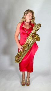We weren’t kidding when we said this fabulous lady played the Saxaphone! Just watch this gal go… Beautiful blonde woman playing her giant Saxaphone. Taking a break from playing Jazz gigs to model our beautiful dresses. Lottie Sax can be found on stage at such legendary clubs as Ronnie Scott’s. Here she is playing along to some Etta James. Stick around she’ll be back 🎶 @lottiebsax #vintagestyle #madeinlondon #1950s #pinupstyle #1940s #saxaphone #vintage #pinup #jazz #retro #retrostyle #reddress