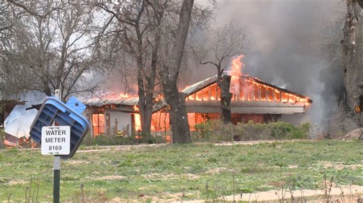 Fire crews battle a huge fire that destroyed a home in Lytle