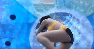 Rookie girl group member Eunsol attempts giant hamster ball in bikini
