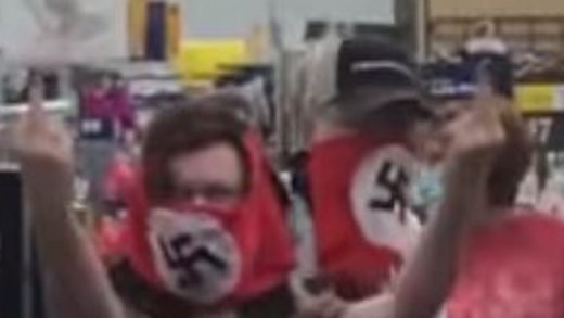 Couple banned from Walmart over swastika face mask stunt