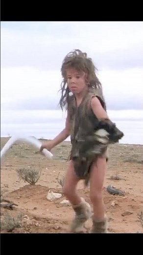 🤯 "The Feral Kid's ICONIC Moment! That Deadly Boomerang Throw in Mad Max 2!" 🌪️🩸#short #movie