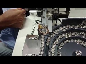 Snap button attaching machine