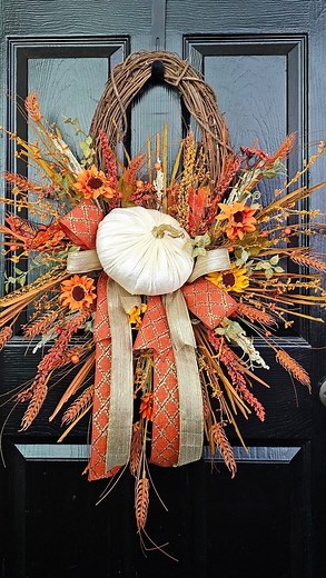 Looking for the perfect fall decor? 🍁✨ Check out this stunning Cream and Orange Pumpkin Grapevine Wreath!🌿 Featuring: an Oval 18” grapevine base, a cream velvet pumpkin 🎃, Sunflower berry sprays 🌻, Rustic wheat accents 🌾 , and Gorgeous fall-themed ribbons 🎀. This wreath is the perfect blend of autumn elegance and rustic charm. 🍂 🍁 🍁 #FallDecor #PumpkinWreath #Wreath #GrapevineWreath #AutumnVibes #DIYDecor #HomeDecor #CraftSupplies #WreathMaking #FallInspiration #FarmhouseStyle #fallwrea