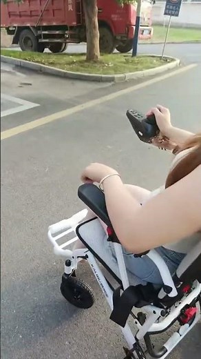 Shera paraplegic woman with no shoes in her power chair