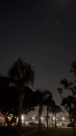 Boeing Airplane Landing Over Night Cityscape