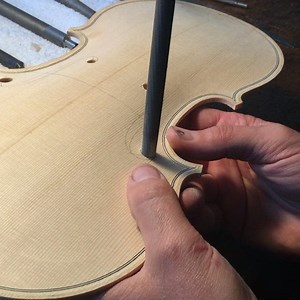 Touching up the holes after glue-sizing them. I'll do that process a couple of times or until the grains stop swelling up. #violin #luthier #liuteria #Pressenda #lovemyjob | Benning Violins