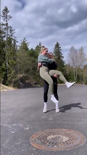 lesbian couple lift and carry